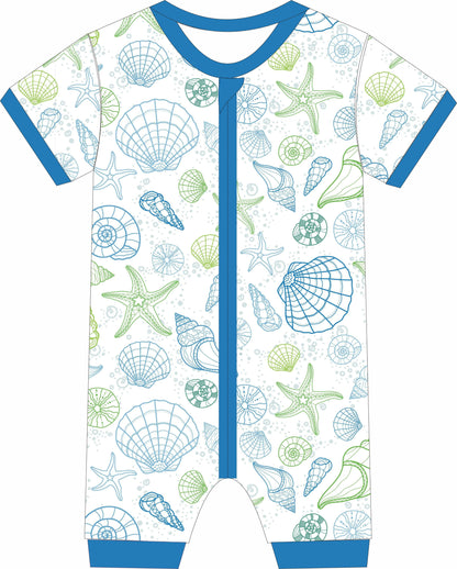 Children's jammies with sea shell and starfish pattern on a white background