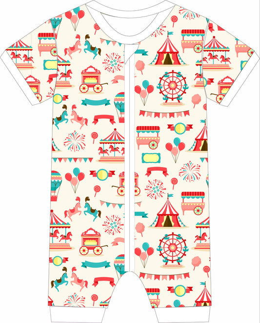 Children's jammies with a colorful circus-themed pattern on a white background