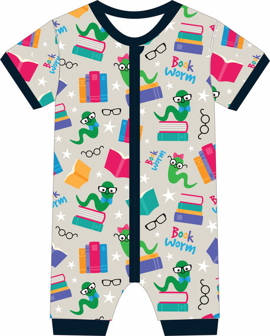 Children's jammies with book-themed design on a light gray background