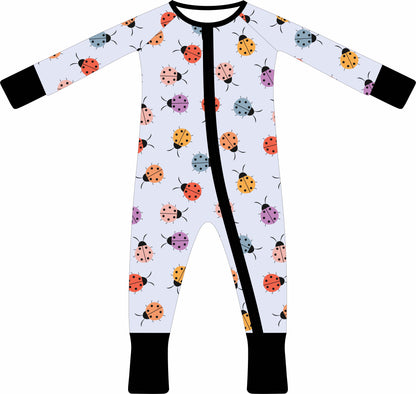 Baby jammies with ladybug pattern on a white background