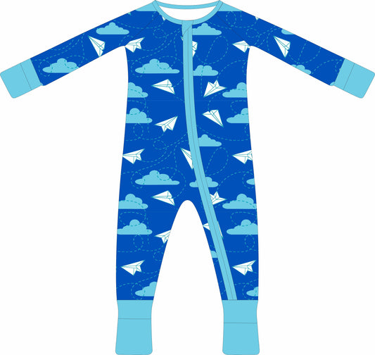 Children's jammies with airplane and cloud pattern on a blue background