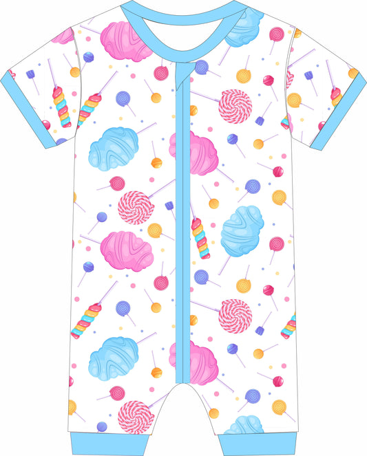 Children's jammies with colorful candy-themed design on a white background