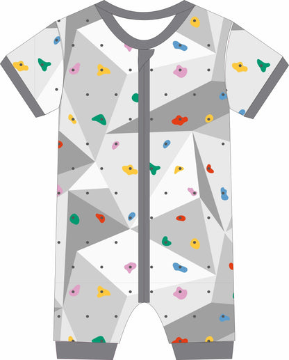 Baby Jammies with geometric pattern and colorful shapes on a white background