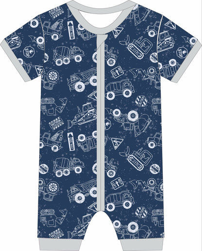 Children's jammies with construction vehicle pattern on a blue background